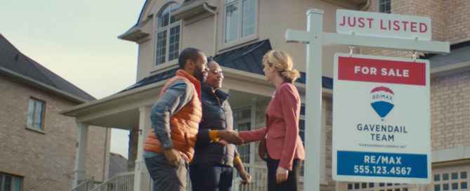 Real estate agent shaking homebuyer's hand