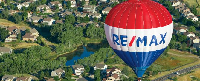 RE/MAX Hot Air Balloon over neighborhood