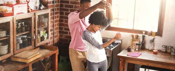 Couple dancing in kitchen