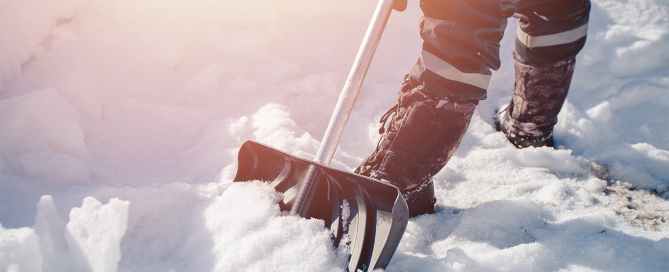 Person shoveling snow after a snowstorm.