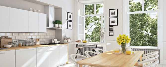 White kitchen with yellow flowers on the table