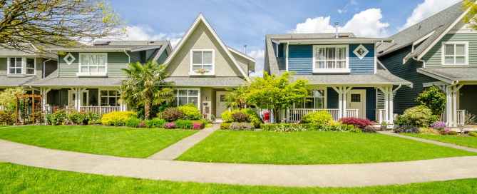Row of houses with manicured lawns