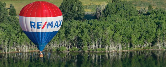 RE/MAX Hot Air Balloon over a lake