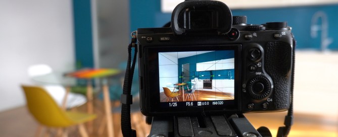 Camera taking photos of a kitchen of a home for sale